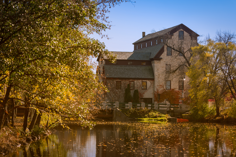 A large old building on a river in fall in Cedarburg Wisconsin best day trips from chicago