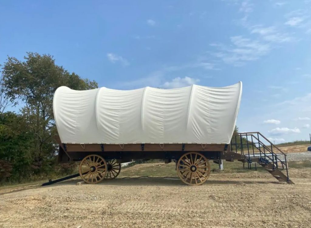 The exterior of a Conestoga Wagon in tent glamping in Ohio