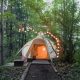 Charming yurt with string of lights surrounding it is one of the coolest glamping in Ohio selections!