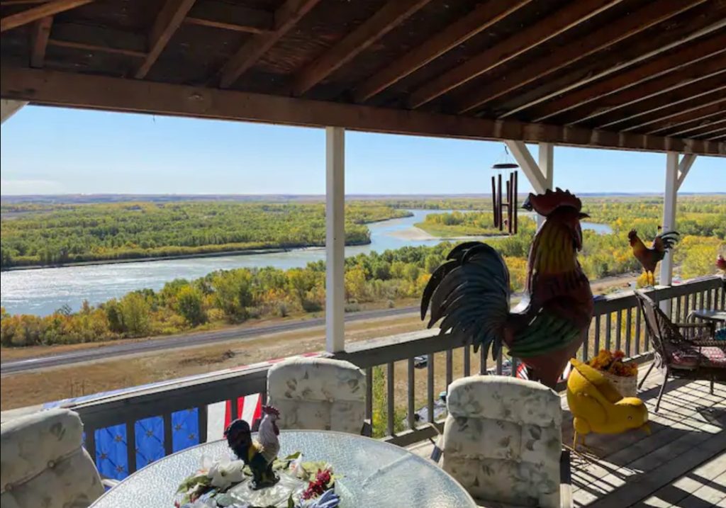 Sweeping views of the Missouri River and surrounding wilderness on the porch of one of the best Airbnbs in North Dakota