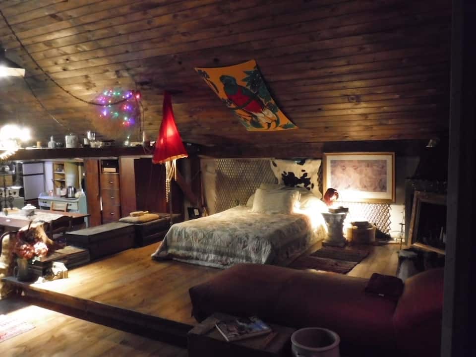 A cabin in Pennsylvania decorated with eclectic design and found objects that makes a cozy space