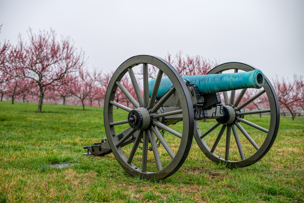 Gettysburg cannon with trees in background, a historical town in PA.