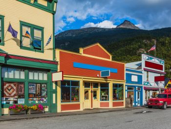vintage buildings very colorful with mountains in background