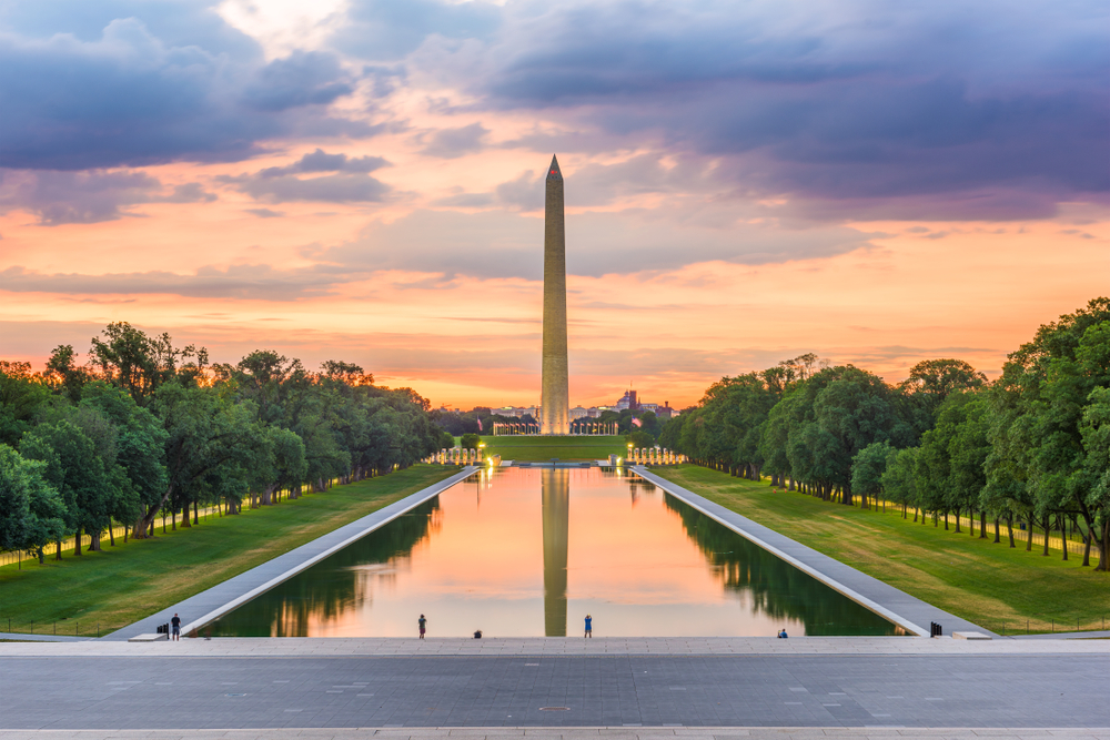 View of the Washington Monument over the Reflecting Pool at sunset.