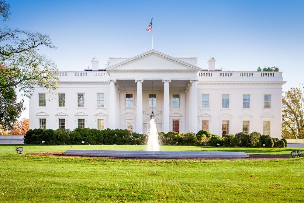 Front of the White House with a fountain.