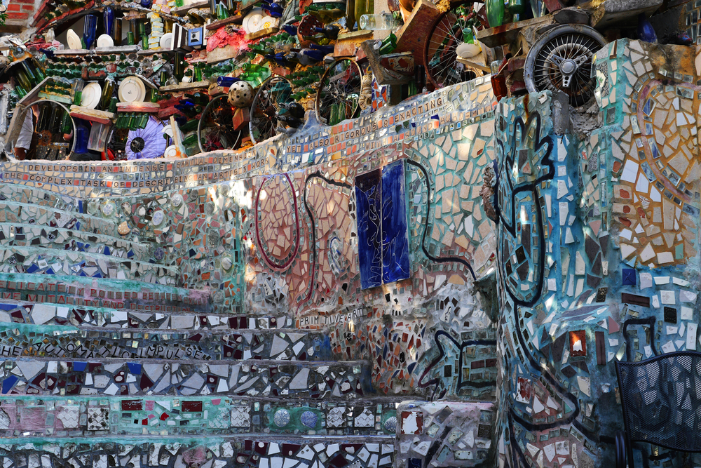 A mosaic wall and stairwell in the Philadelphia Magic Gardens. The mosaic is very elaborate and on top of the mosaic wall is another wall made entirely of found objects. Its one of the best things to do in Philadelphia. 