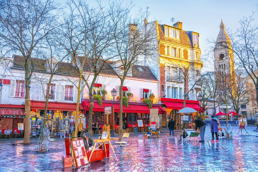 Beautiful cobblestone square with charming colorful buildings with red awnings and artists selling their wares in the square. Add to 3 days  in Paris itinerary.