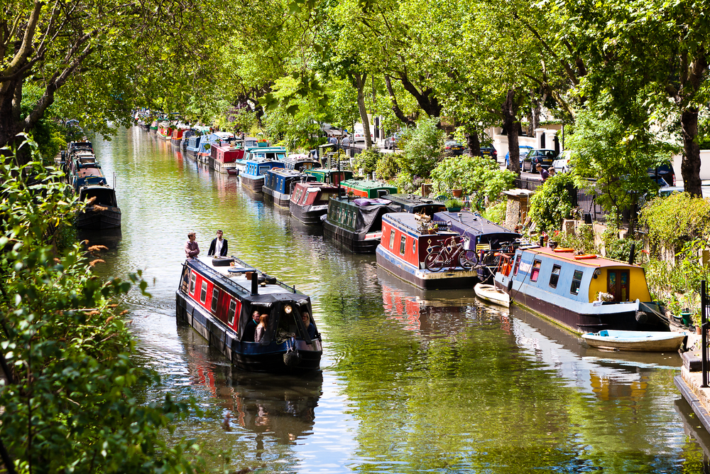 View of Regent’s Canal with many canal boats.