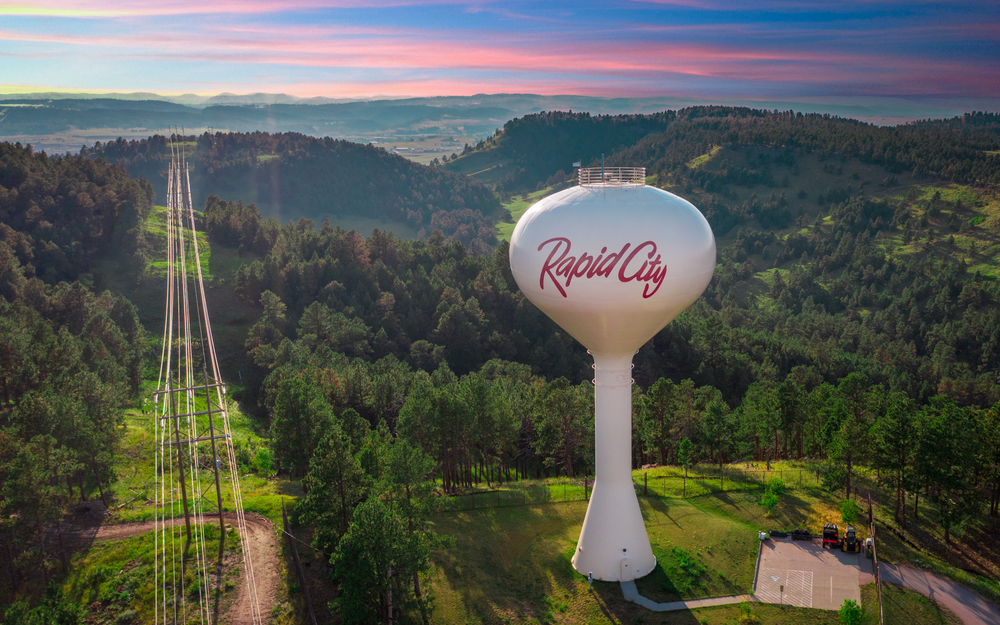 Aerial view of White water tower with red letters saying "Rapid City"