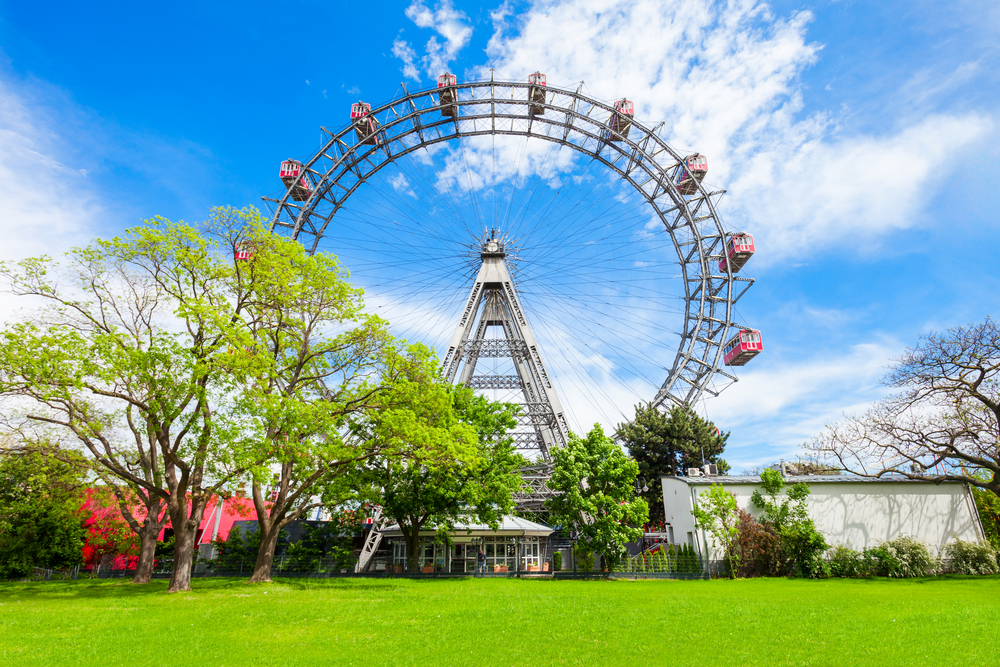 The huge ferris wheel in a park on a sunny day, one of the best things to do in Vienna