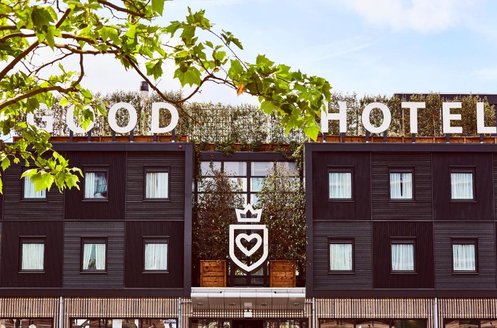 The front of The Good Hotel which is black and wood. This is one of the boutique hotels in London. 