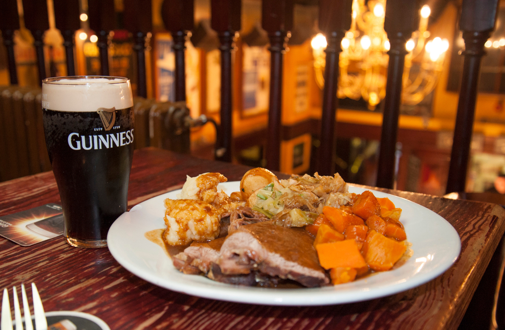 A traditional Irish meal and a pint of Guinness at a pub in Dublin