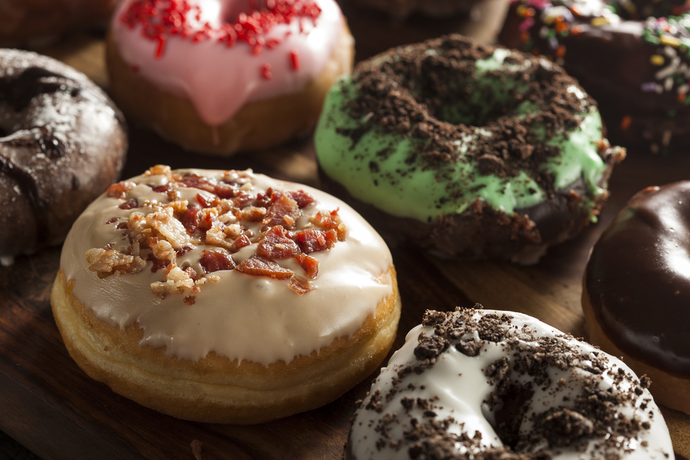 A close up of a selection of gourmet donuts
