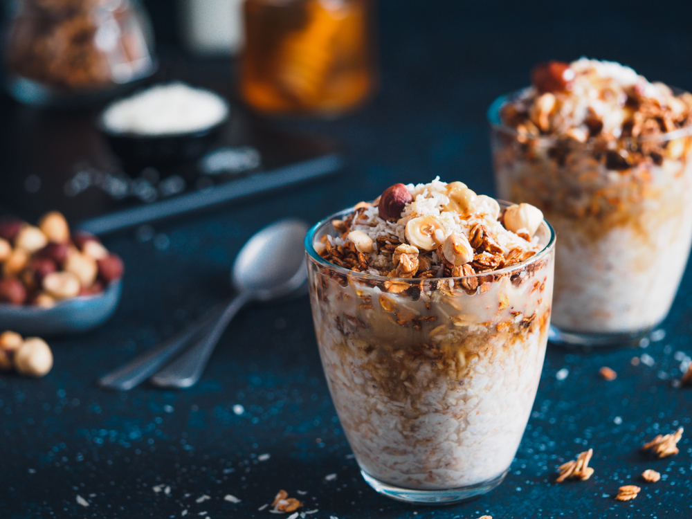 Two glass cups with overnight oats in them similar to what you can find for breakfast in Dublin