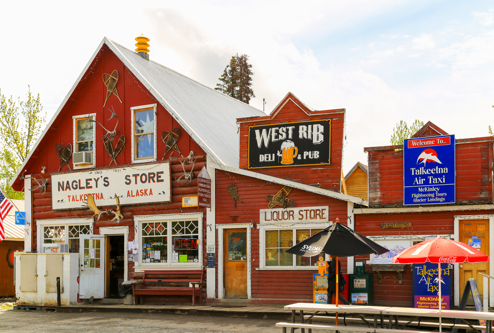 The red and white Nagley's General Store with many signs and decorations on it.