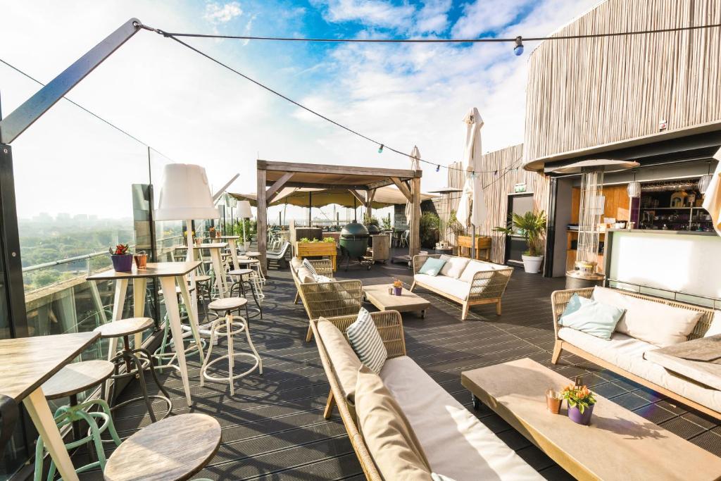 A rooftop bar at a boutique hotel in Amsterdam that has plenty of seating and overlooks the city