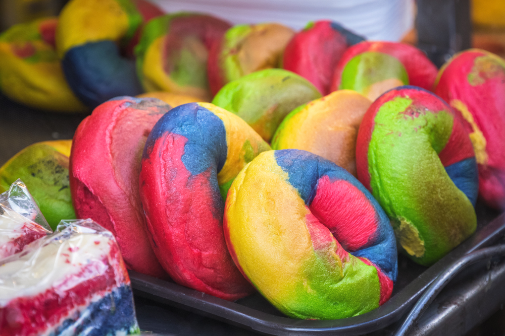 Rainbow bagels displayed at bagel shop on Brick Lane. One of the things to do in Shoreditch. 