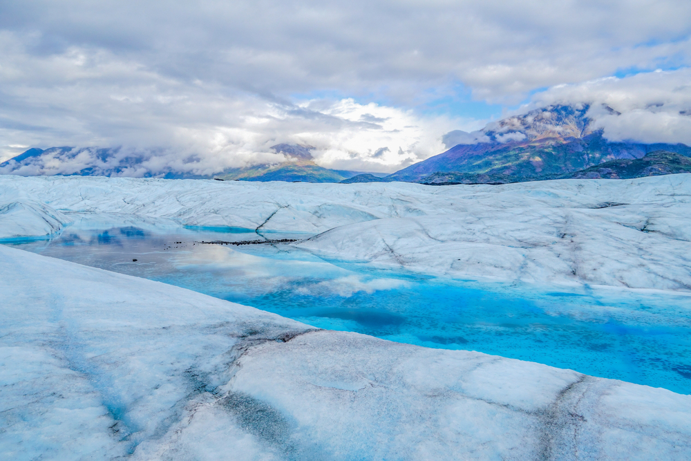 View of a glacial lake in the great expanse of ice that makes up Knik Glacier in Alaska.