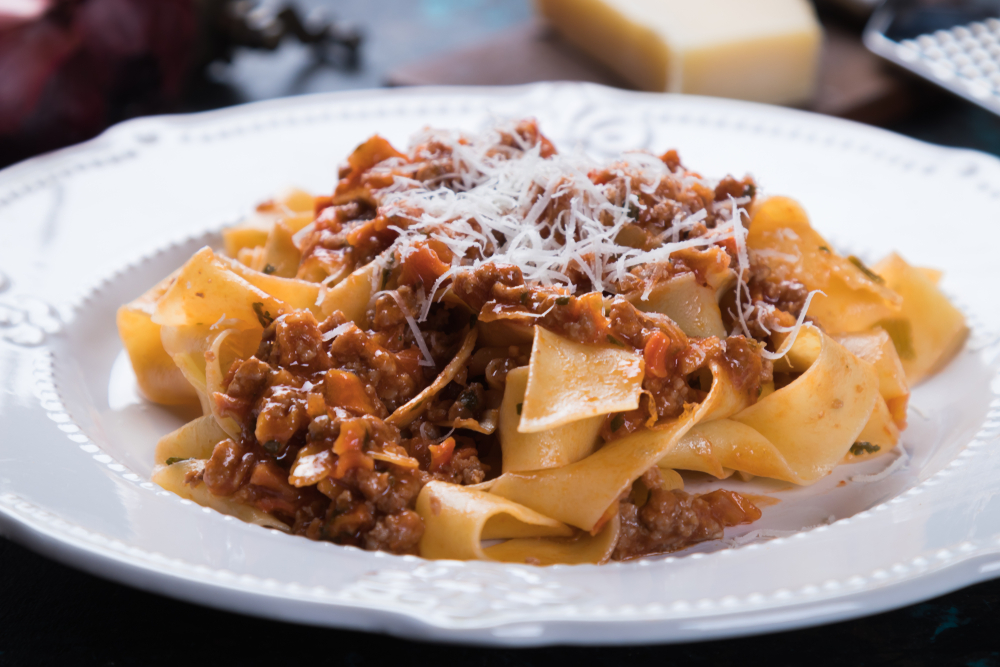 Ragu bolognese, italian ground beef sauce with  pappardelle pasta. The article is about the best restaurants in Covent Garden. 