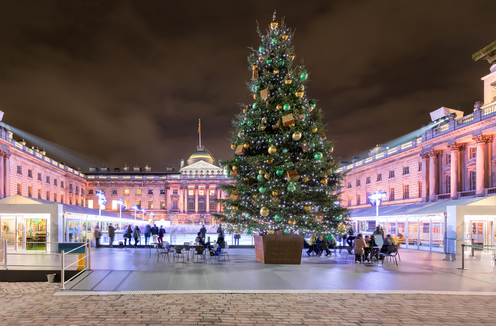 Somerset House in London with a christmas tree and ice rink in winter time