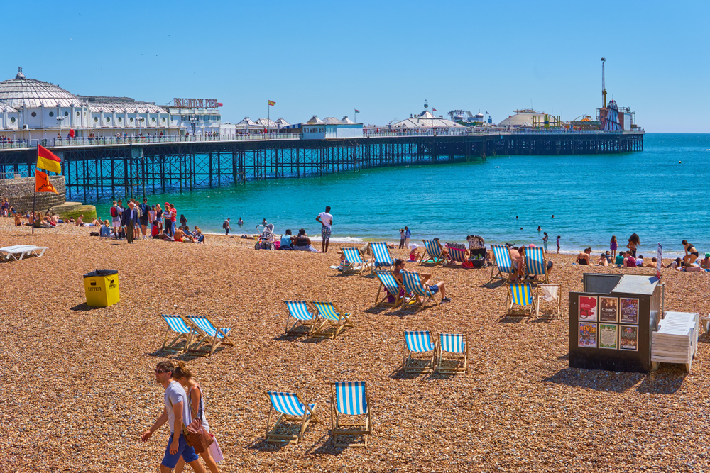 Brighton seafront and beach activities, crowds in sweltering record temperatures. One of the day trips from London by train 