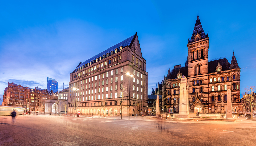 The old and new town hall buildings in the city centre of Manchester, England.