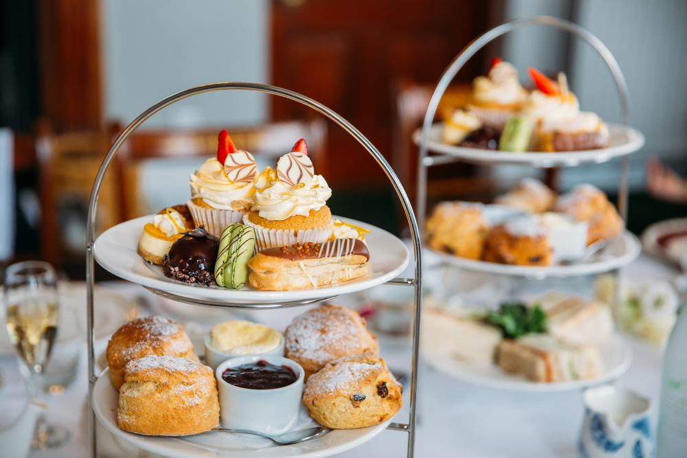 Tiered trays with afternoon tea treats.