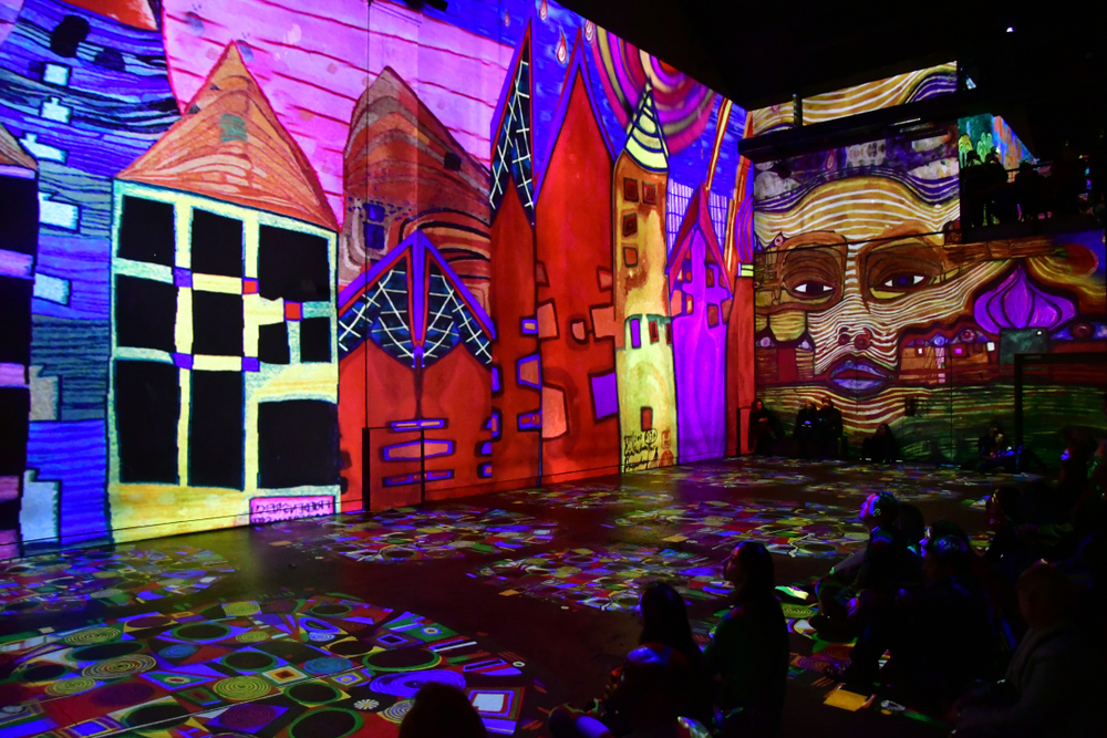 Colorful displays of art at Atelier des Lumières in Paris.