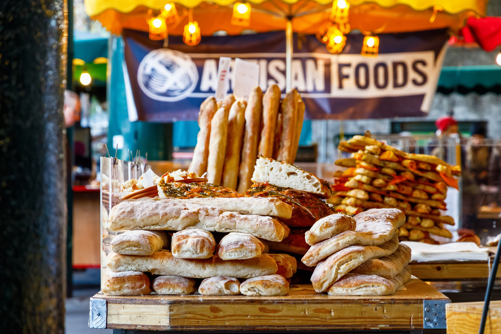 Freshly baked breads on display at Borough Market, London. The article is about the best markets in London 
