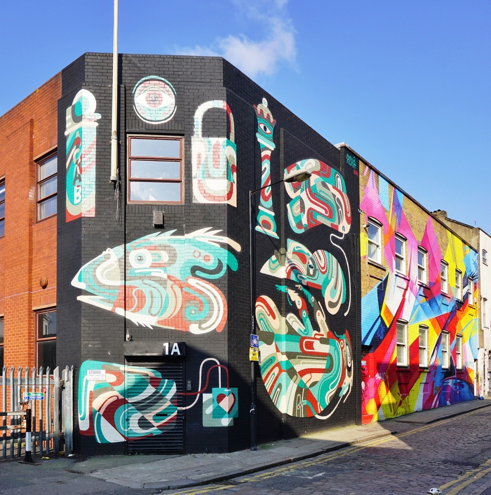 Painted walls and graffiti art are scattered in the Brick Lane and Shoreditch area. The article is about the best walks in London
