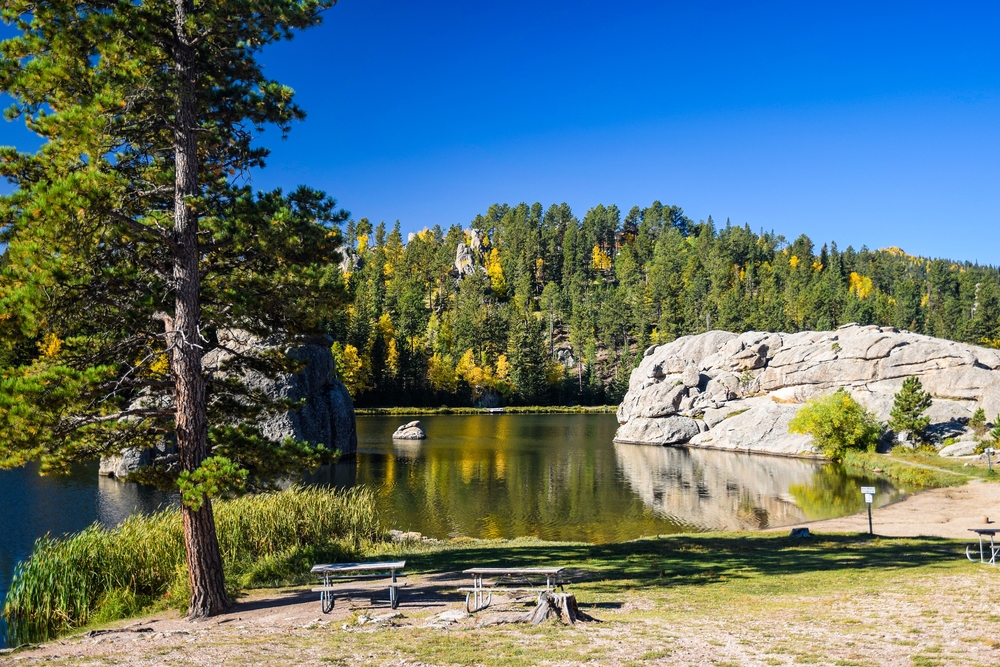 Sylvan Lake in Custer State Park with big rocks, pine trees, and fall colors during a Midwest weekend getaway.