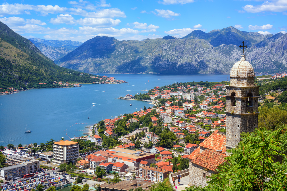 View looking down at historic Kotor on the water, one of the Best Day Trips from Dubrovnik.