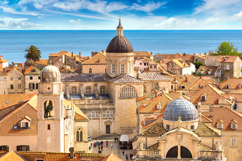 View looking down at rooftops and churches in Old Town Dubrovnik, Croatia.