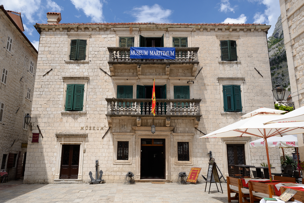 Exterior of the Maritime Museum in an old, white stone building in Kotor.