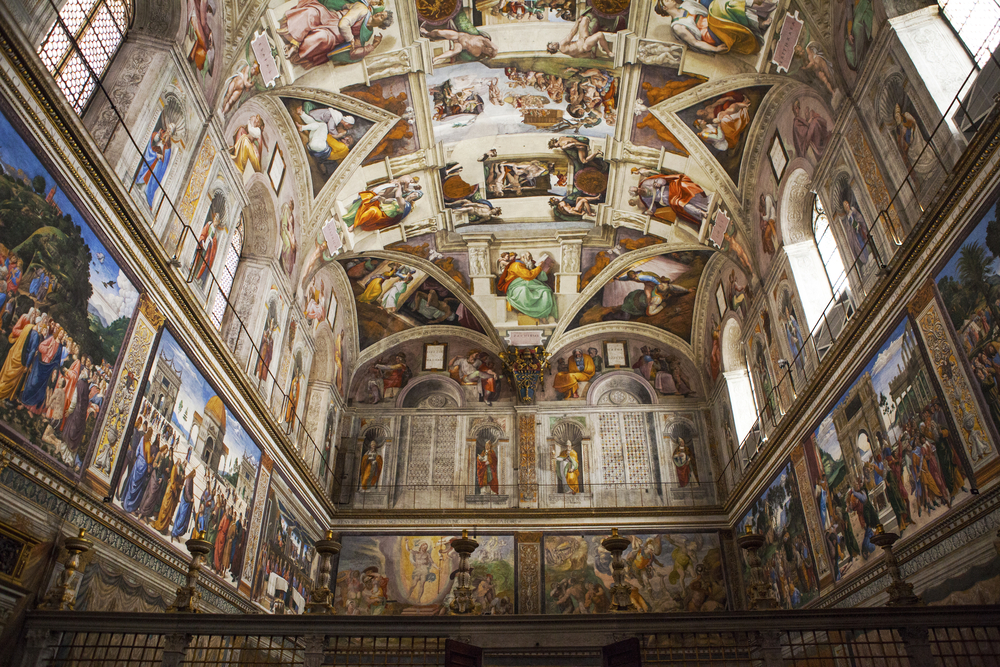 Detailed paintings adorning the Sistine Chapel during Rome in a day.