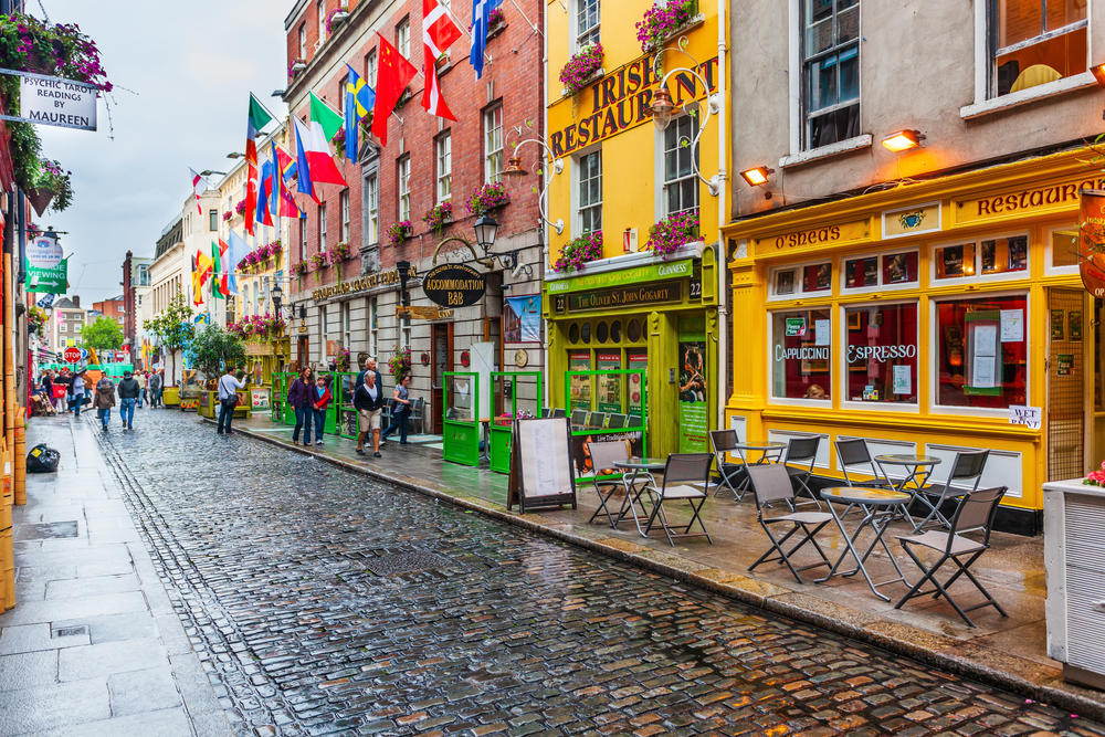  View of pub street in the downtown of Dublin. The buildings are colorful and the article is about one day in Dublin.  