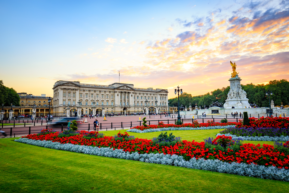 Buckingham Palace with the Victoria statue in front and flowers. I day in London. 