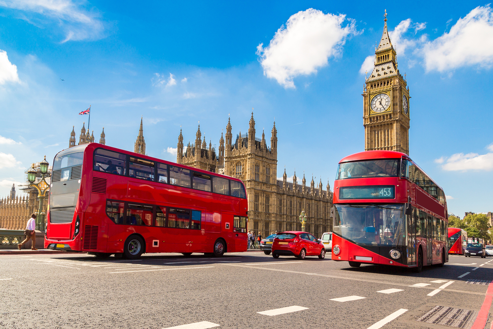 Big Ben, Westminster Bridge and red double decker bus in London. The article is about 1 day in London 