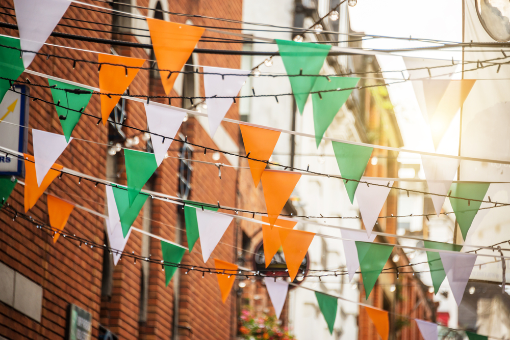 Garland with irish flag colors in a street of Dublin, Ireland - Saint Patrick day celebration