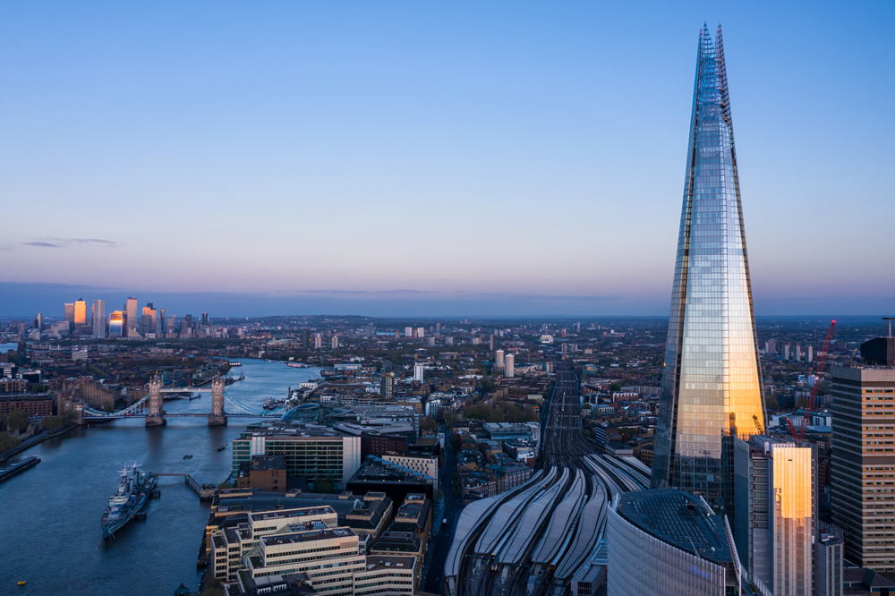 Dusk over the Shard and the London skyline with the river.