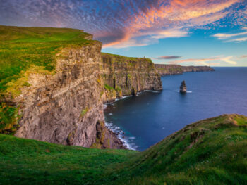 cliffs overlooking the ocean during sunset cliffs of moher ireland