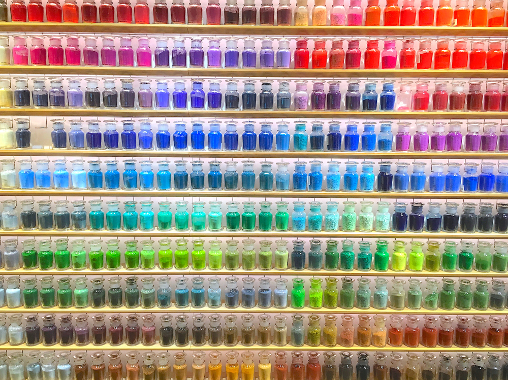 Rows of colorful powdered pigment at an art supply store one of the most unusual things to do in Tokyo