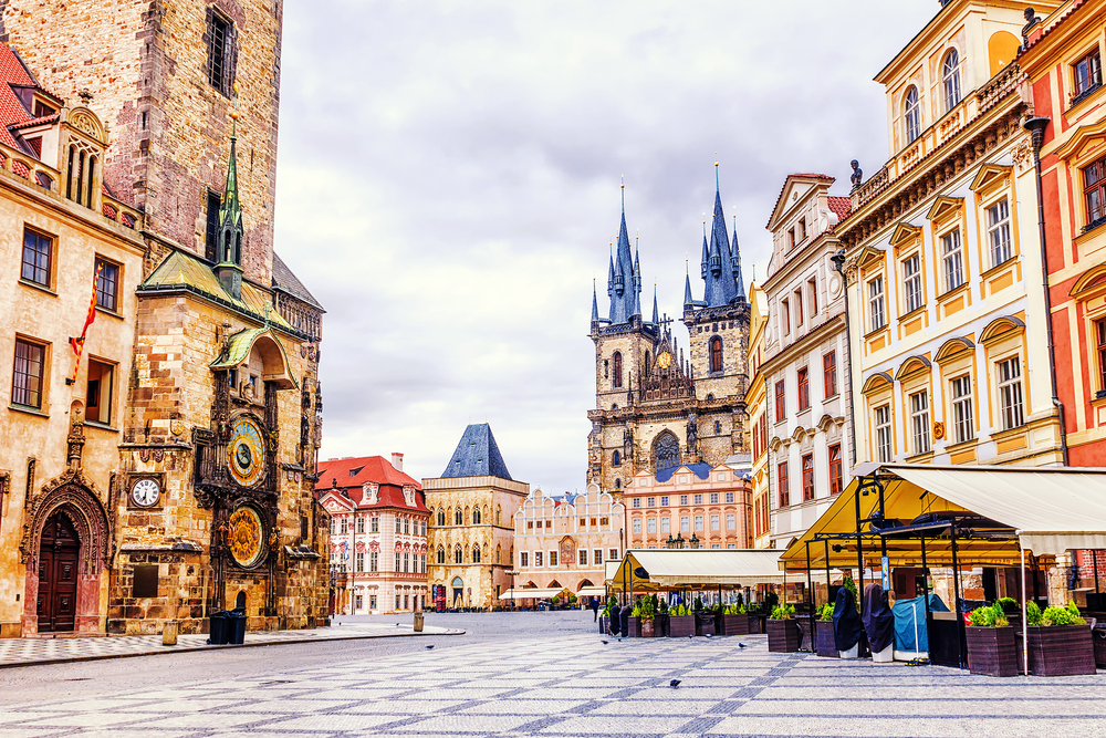 Cloudy day over the Old Town Square with Astronomical Clock and Church of Our Lady Before Tyn during one day in Prague.