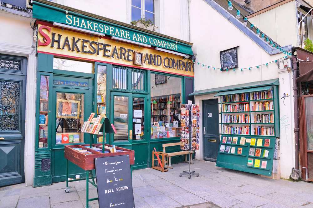 The entrance to the Shakespeare & Company Bookstore with outdoor book displays.