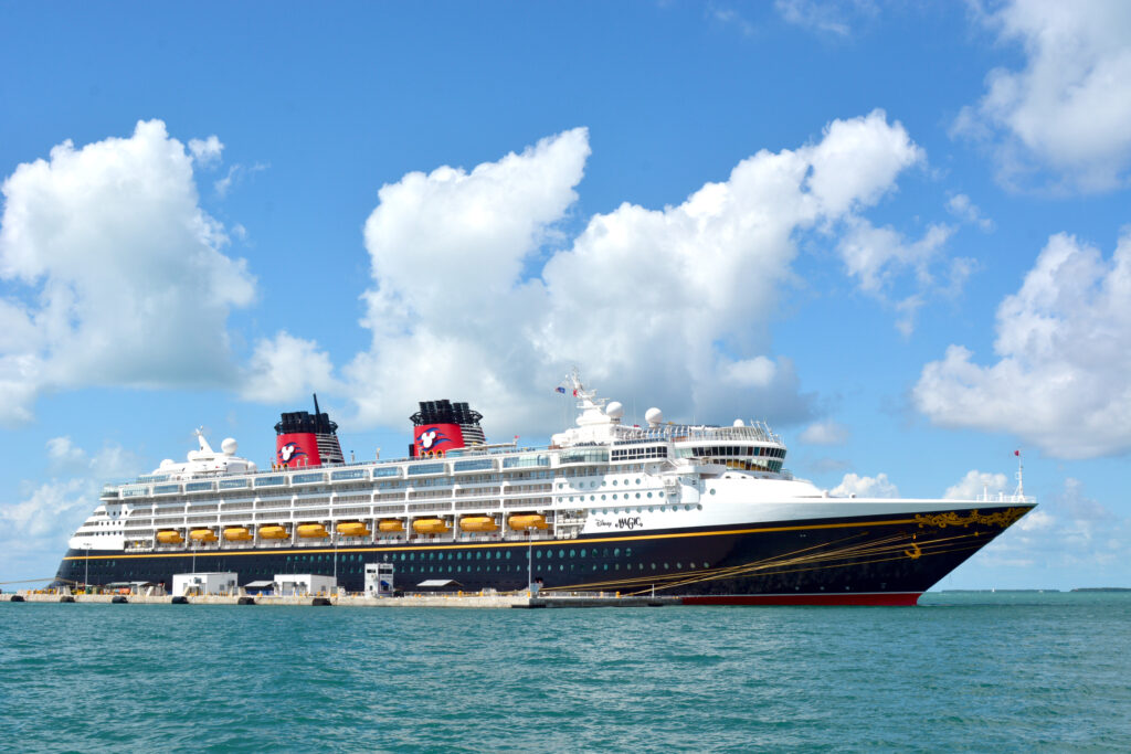 Disney cruise packing list for blue and white cruise ship with red stacks
