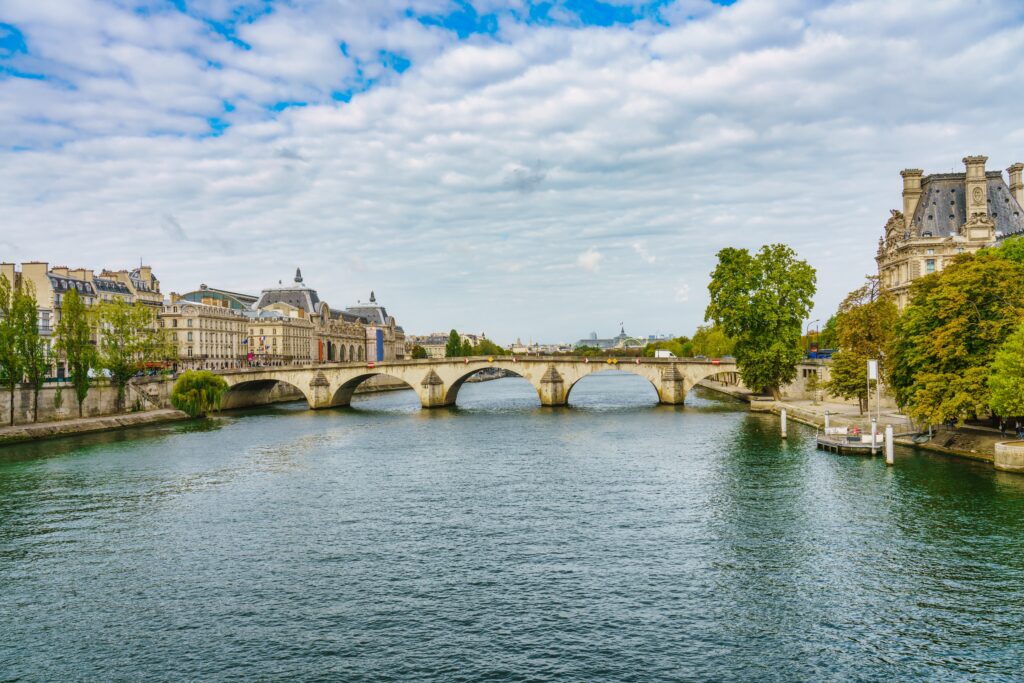 Ornate bridge in Paris with opulent buildings on either side