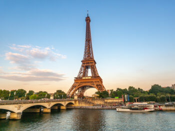 View looking across the river to the sun-kissed Eiffel Tower during one day in Paris.