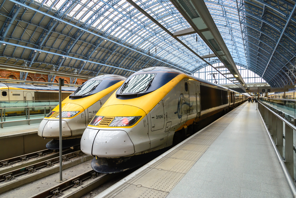 Two Eurostar trains inside the London St. Pancras train station.