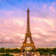 Eiffel Tower with pink and blue sunset behind it