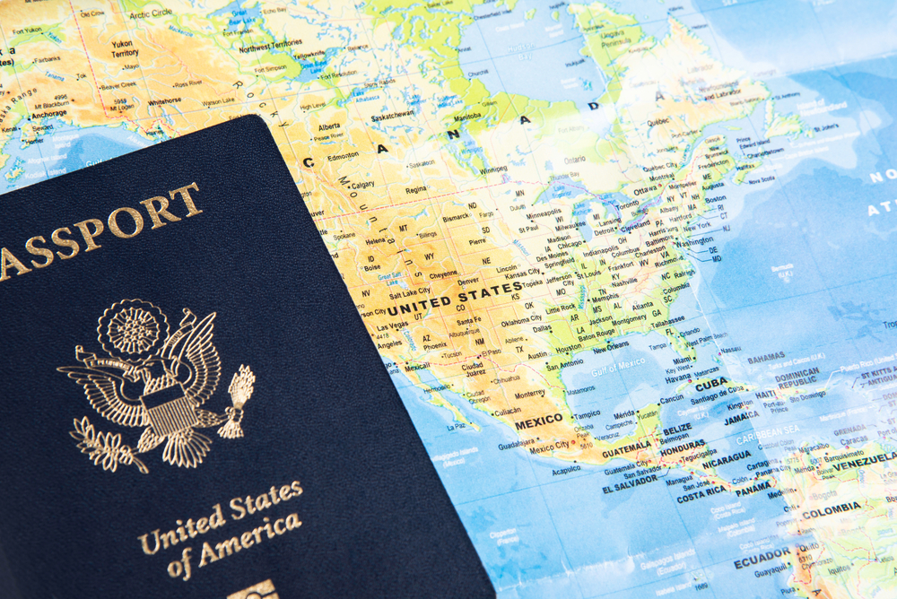 Travelling solo for seniors: passport and world map in back ground